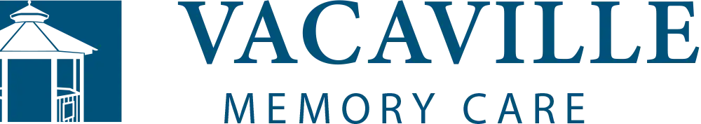 Vacaville Memory Care logo in blue and white.